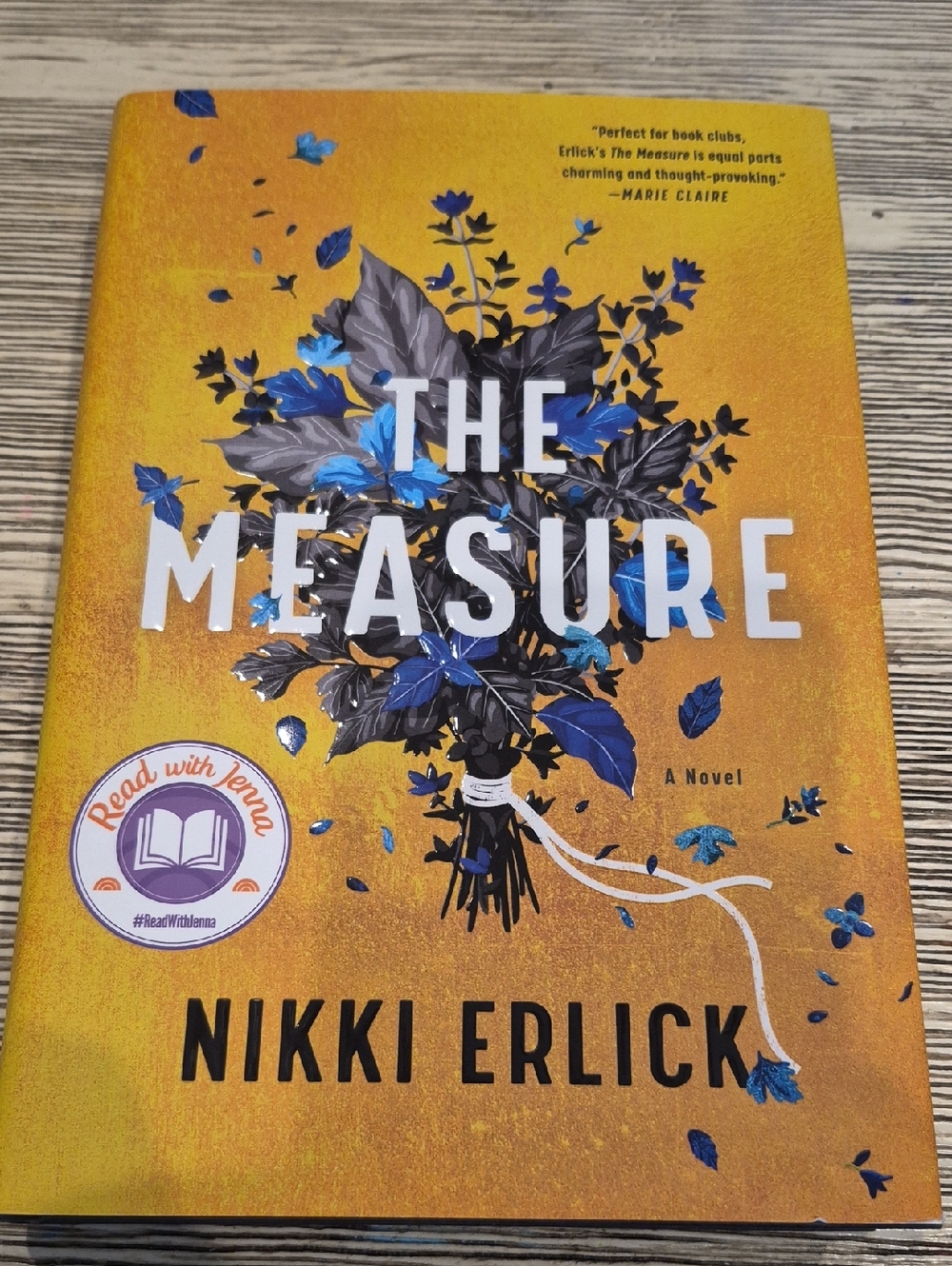The Measure by Nikki Erlick - Yellow & Blue Hardcover